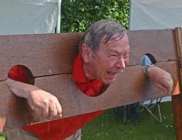 District Governor Roger cools off in the stocks